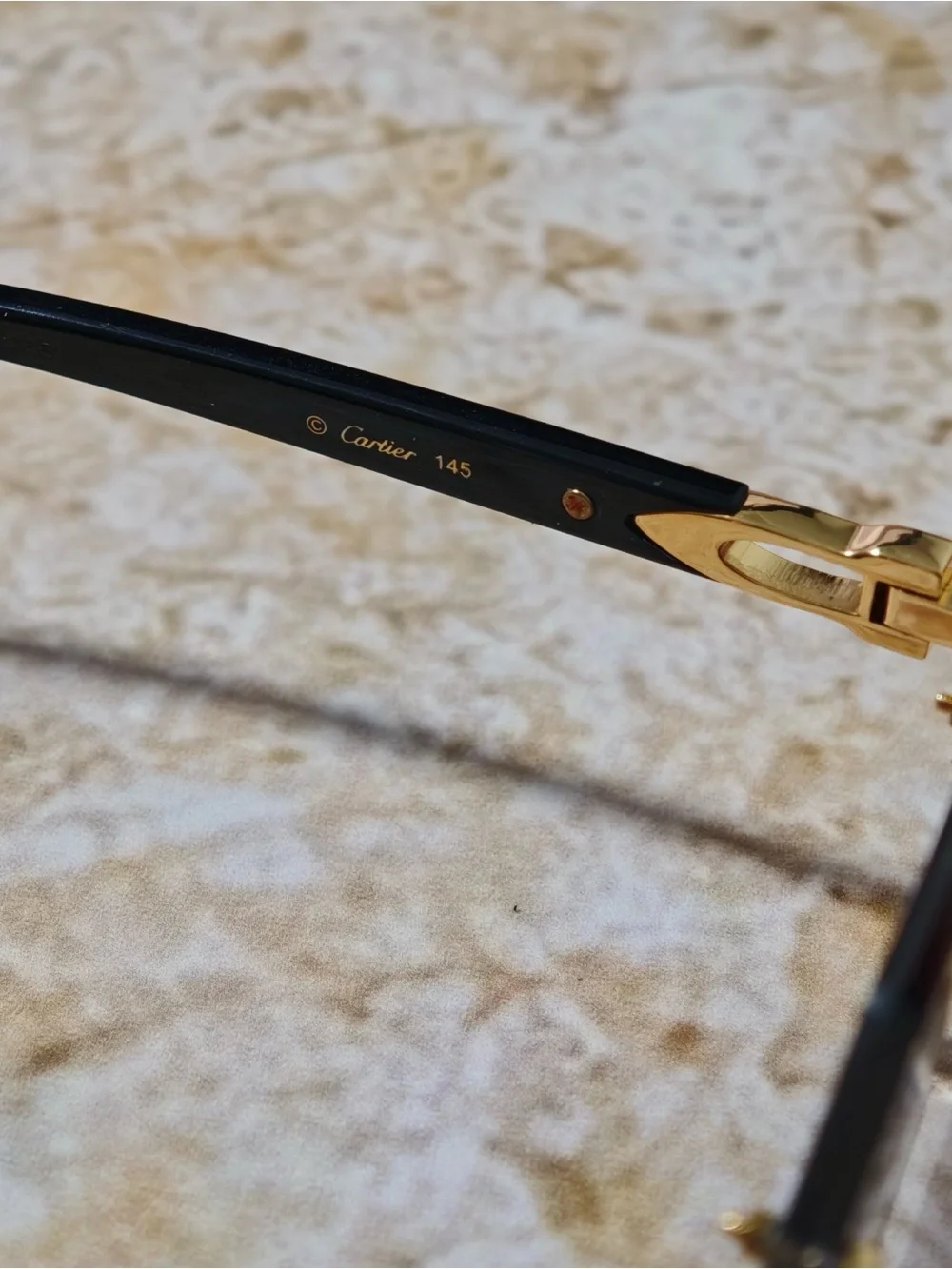Cartier Women’s Rimless Sunglasses with Purple Gradient Lenses and Gold Accents